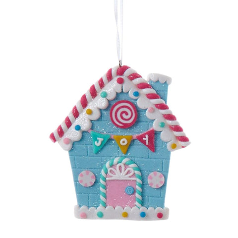 Joy iced candy cottage claydough ornament with blue walls, pink door, candy cane trim, sprinkle details, and a colorful JOY banner.