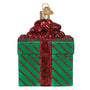 Green gift box ornament with red ribbon on a white background
