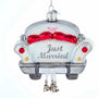 Decorative ornament shaped like a wedding car with 'Just Married' text on a white background