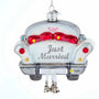 Personalized Just Married car with bells ornament featuring a white getaway car, red seats, silver glitter accents, dangling bells, and hanging loop.