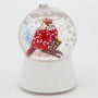 Cardinal waterglobe ornament with a red cardinal on a branch inside a clear globe with floating glitter and a white glittered base.