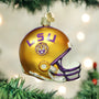 Glass LSU football helmet ornament on a Christmas tree with lights in the background