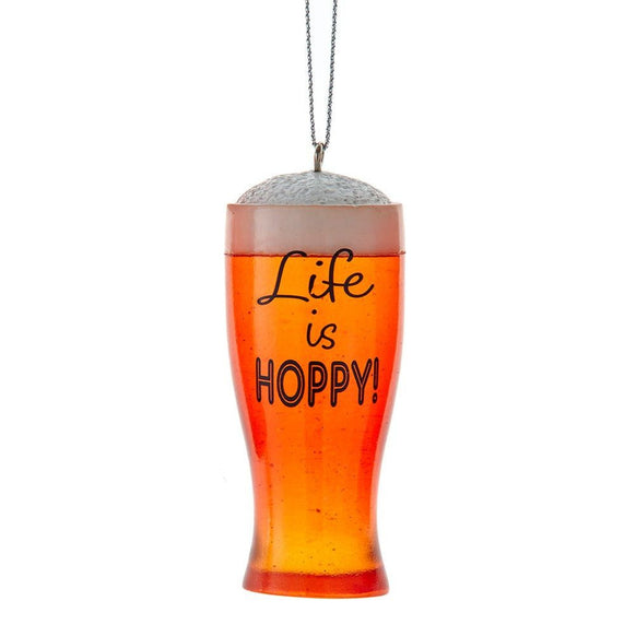 Ornament shaped like a frothy pint glass filled with amber beer and the words “Life is Hoppy!”