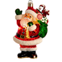 Lighted glass Santa ornament in a red suit holding a green gift bag filled with candy canes and presents.