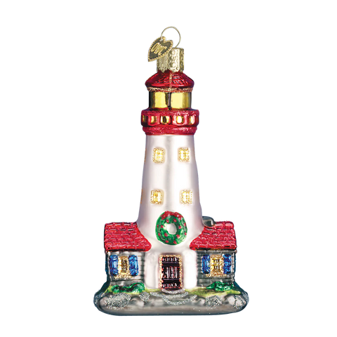 Decorative glass lighthouse ornament on a white background