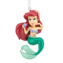Mermaid figurine ornament with red hair and green tail on a white background