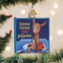 Ornament shaped like a book titled 'Llama Llama Red Pajama' hanging on a Christmas tree.