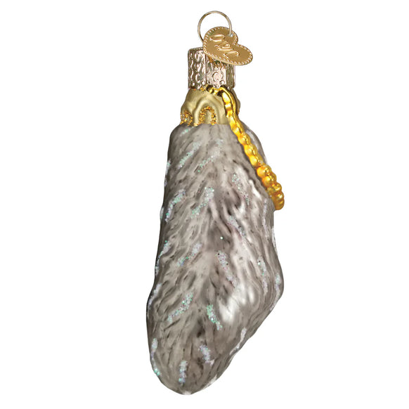 Glass Lucky Rabbit Foot ornament with gold accents on a white background
