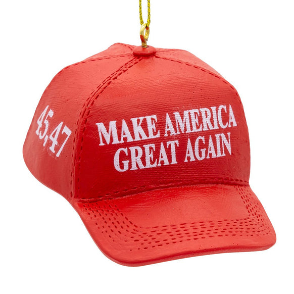 Red hat ornament styled like a campaign cap with white “Make America Great Again” lettering on the front and “45-47” on the side.
