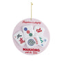 Decorative ornament with Mahjong tiles and text on a pink background