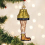 Christmas ornament shaped like a man leg with a lampshade and boot, hanging on a decorated tree.