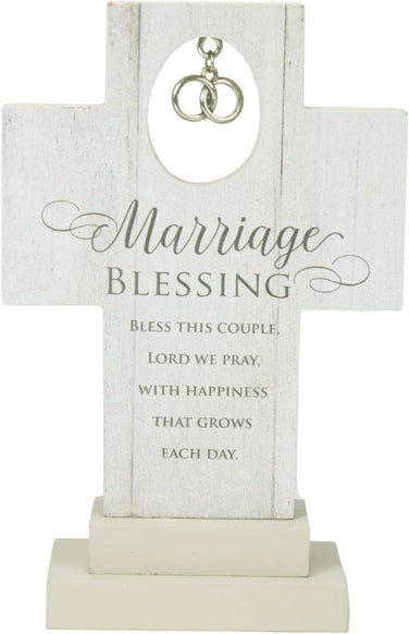 White freestanding cross with silver intertwined rings and the words “Marriage Blessing” above a printed blessing for a couple.