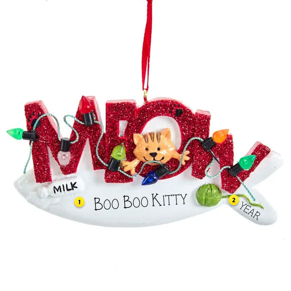 Decorative ornament with ''Meow" and cartoon cat, surrounded by Christmas lights and text on a white background.