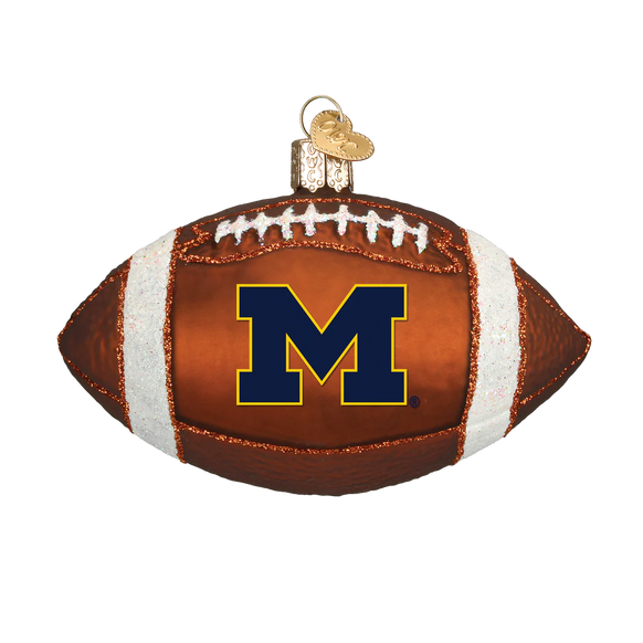 Glass Michigan football ornament with 'M' logo on a white background