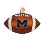 Glass Michigan football ornament with 'M' logo on a white background