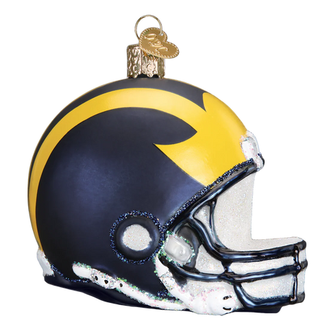 Glass ornament shaped like a Michigan football helmet with blue and yellow colors on a white background
