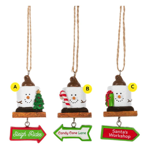 Three Mini S’mores Christmas Sign ornaments shown together, each featuring a marshmallow snowman-style figure on a graham cracker base with a dangling holiday arrow sign reading “Sleigh Rides,” “Candy Cane Lane,” or “Santa’s Workshop.”