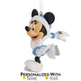 Decorative ornament of Minnie in a Santa hat and ice skates on a white background
