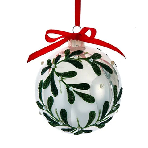 Christmas ornament with mistletoe design and red ribbon on a white background