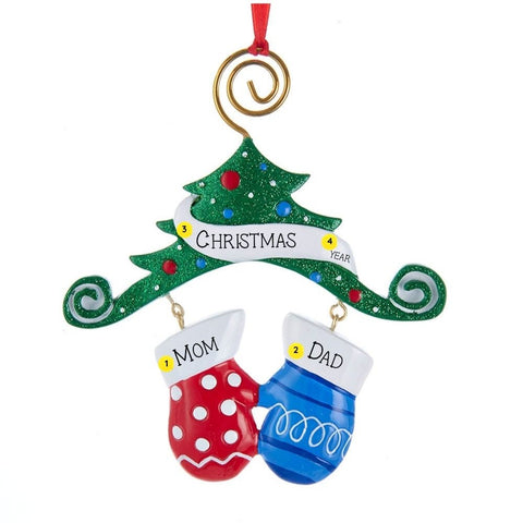 Personalized ornament with two colorful mittens hanging beneath a glittered Christmas tree, with space for two names, a holiday word or phrase, and the year.