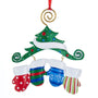 Christmas ornament with mittens and a tree on a white background