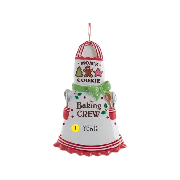 Mom’s Cookie Baking Crew apron ornament with cookie accents, baking tools, festive red and white details, and sample year personalization.