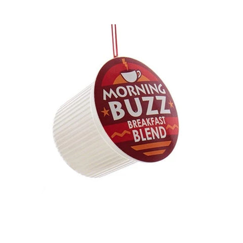 Coffee pod ornament with a red label reading “Morning Buzz Breakfast Blend” hanging from a red cord.