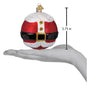 Decorative Christmas ball ornament resembling Santa Claus outfit on a hand with measurement label.