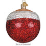 Red glittery Christmas ornament with white top on a white background