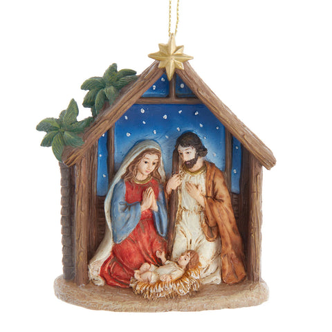 Nativity stable ornament featuring Mary, Joseph, and Baby Jesus in a manger beneath a gold star with a blue night sky background.
