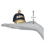 Navy cap ornament with 'NAVY' text on a white background, shown on a hand for scale.