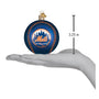 Blue baseball ornament with New York Mets logo held in a hand, showing size measurement