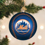Blue baseball-shaped ornament with 'Mets' logo on a Christmas tree.