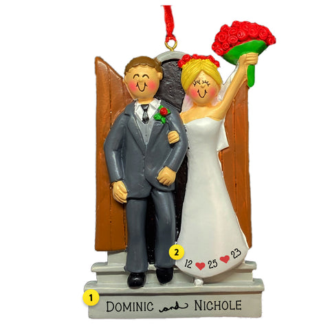 Personalized Bride and Groom ornament with bride holding red rose bouquet on steps