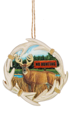 No Hunting Deer ornament featuring a brown buck standing in a nature scene with trees, water, and tall grass, framed by a ring of antlers and a rustic “No Hunting” sign.