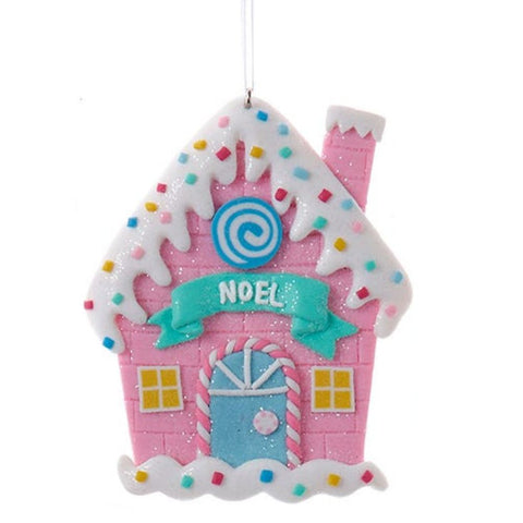 Noel iced candy cottage claydough ornament with pink walls, blue door, candy cane trim, sprinkle details, and a teal NOEL banner.