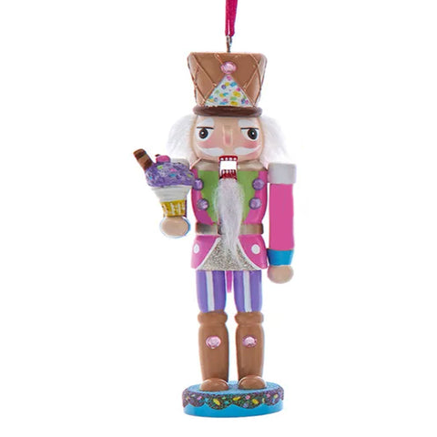 Colorful nutcracker ornament holding a ice cream cone on a white background