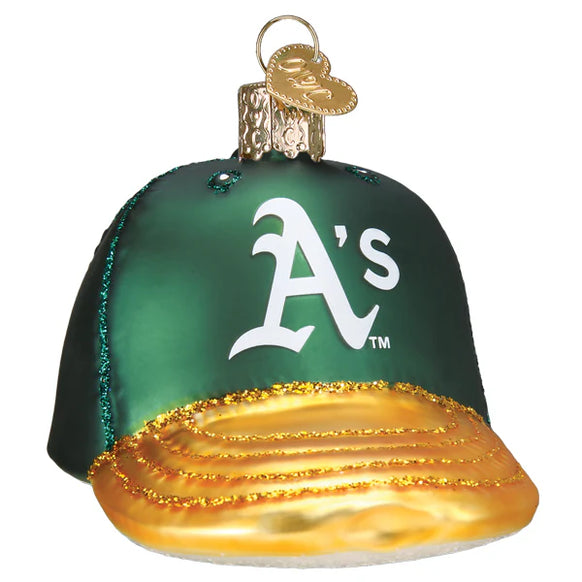 Glass ornament of a green baseball cap with a gold brim and 'A's' logo on a white background