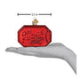 Red 'Oh Fudge' sign ornament held in a hand with measurement label