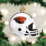 Decorative Oregon football helmet ornament with logo on a Christmas tree.