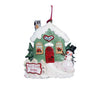 Personalized Our First Home Snowy Cottage Ornament with green cottage, red door, snowy roof, snowman, and Our First Home sign.