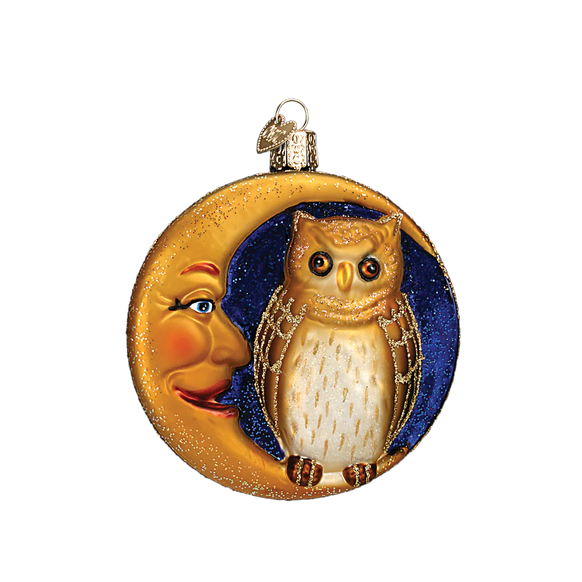 Decorative ornament with an owl and moon design on a white background