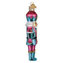 Decorative glass nutcracker ornament on a white background