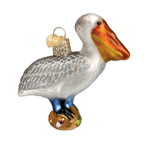 Glass ornament of a pelican on a white background