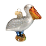 Glass ornament of a pelican on a white background