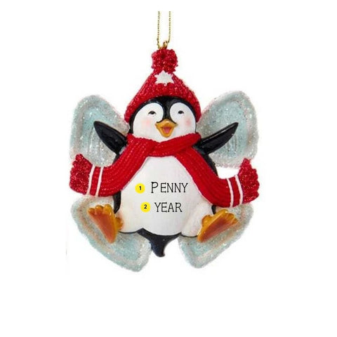 Personalized penguin snow angel ornament with a red glitter hat, scarf, sparkling wings, and space for a name and year.