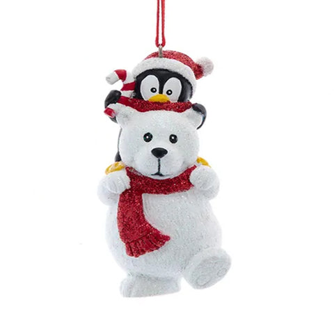 Polar bear ornament with penguin on a white background