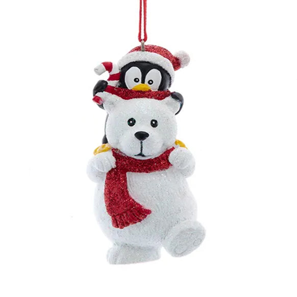 Polar bear ornament with penguin on a white background
