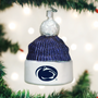 Christmas ornament shaped like a beanie with a Penn State logo, hanging on a tree.
