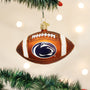 Glass football ornament with a Penn State logo, hanging on a Christmas tree.